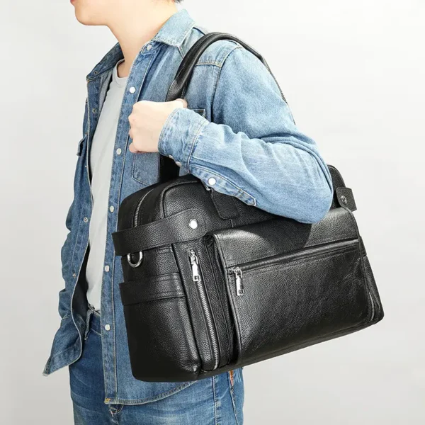 1 (10) Man carrying black leather duffle bag, casual denim style