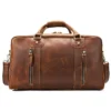 1 (10) Vintage brown leather duffle bag with multiple compartments, plain background