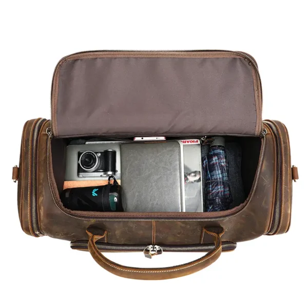 1 (11) Open vintage brown leather duffle bag showing interior compartments