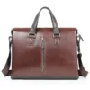 Vintage brown leather briefcase with front zipper, white background