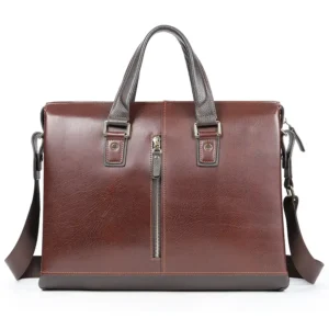 Vintage brown leather briefcase with front zipper, white background