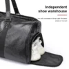 1 (17) Black leather duffle bag with independent shoe compartment, product shot