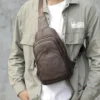 1 (17) Man wearing brown leather sling bag, casual style