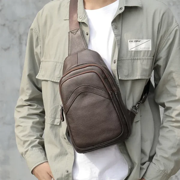 1 (17) Man wearing brown leather sling bag, casual style