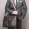 1 Business man holding black leather tote bag, office professional style