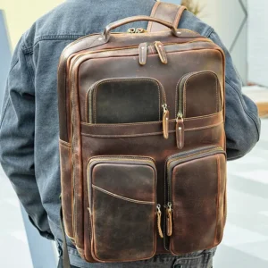 Man carrying brown leather backpack, casual outdoor look