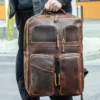 1 (27) Business man holding brown leather backpack, office style