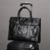1 (5) Black leather briefcase with trolley sleeve, travel design