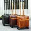 1 Black and brown leather trolley luggage set, studio display