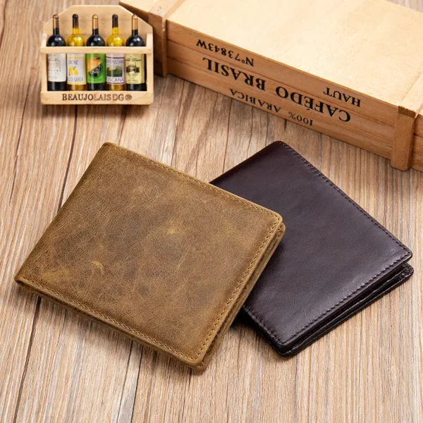 Two brown leather wallets on vintage book background