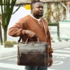 18 Man holding brown leather briefcase, business casual outfit