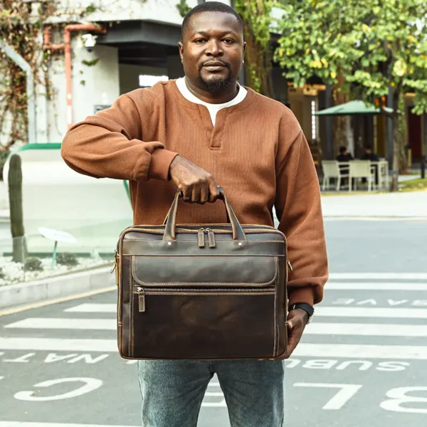 19 Man carrying brown leather briefcase, outdoor casual style