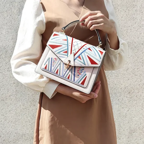 3 Woman carrying patterned leather crossbody bag, casual style