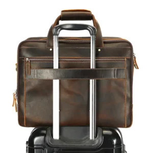 Brown leather briefcase with trolley sleeve, travel design