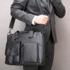 7 Business man carrying black leather tote bag, formal suit style
