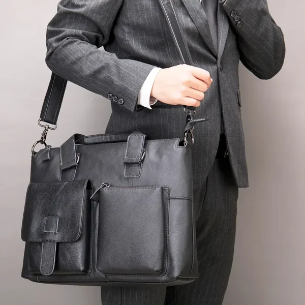 7 Business man carrying black leather tote bag, formal suit style