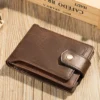 750x1000 Brown leather wallet on natural wooden background