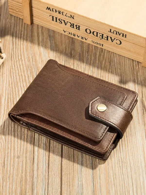 750x1000 Brown leather wallet on natural wooden background