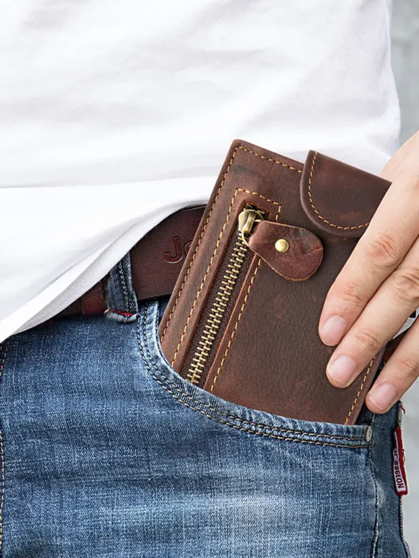 Brown leather zip wallet in jeans pocket, casual daily use