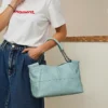 ai3 Light blue leather handbag 4-angle collage, front/side views