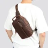 咖啡 (5) Man carrying brown leather sling bag, back view