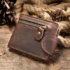 Brown leather zip wallet with snap closure, rustic background