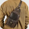 Man carrying brown leather sling bag, casual daily use