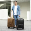 组合-(1) Man carrying brown leather trolley luggage with black bag, business style