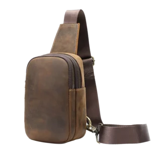 Vintage brown leather sling bag, plain studio shot