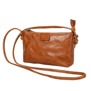 Vintage brown leather crossbody bag, plain studio shot