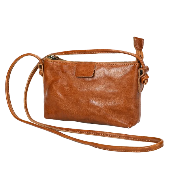 Vintage brown leather crossbody bag, plain studio shot