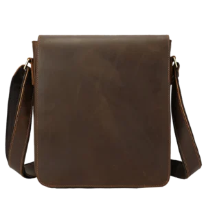 Brown leather crossbody bag, plain studio background