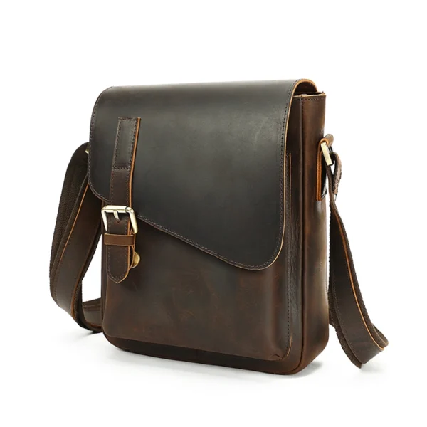 首图白底图 Brown leather messenger bag with buckle closure, white background