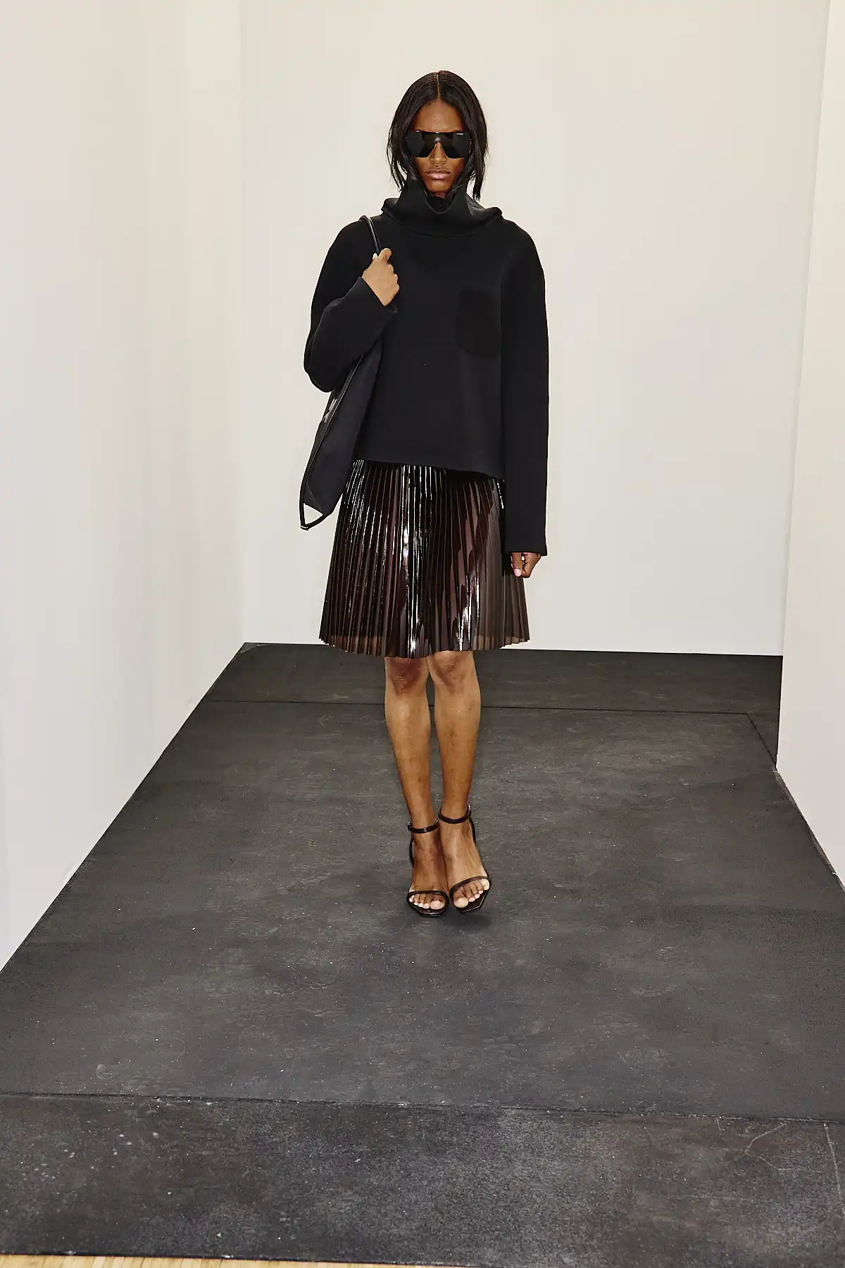 Model with womens leather backpack