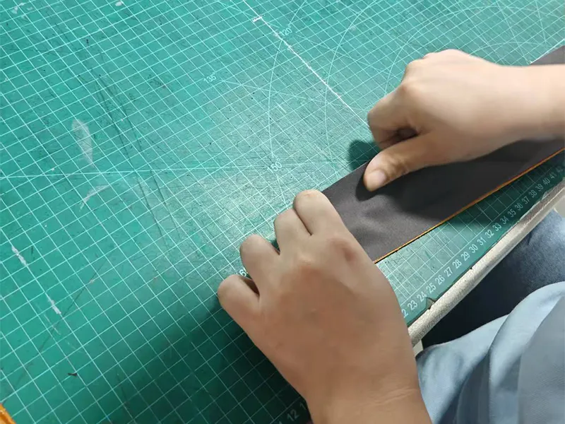 Sorting die‑cut genuine leather parts for bag assembly