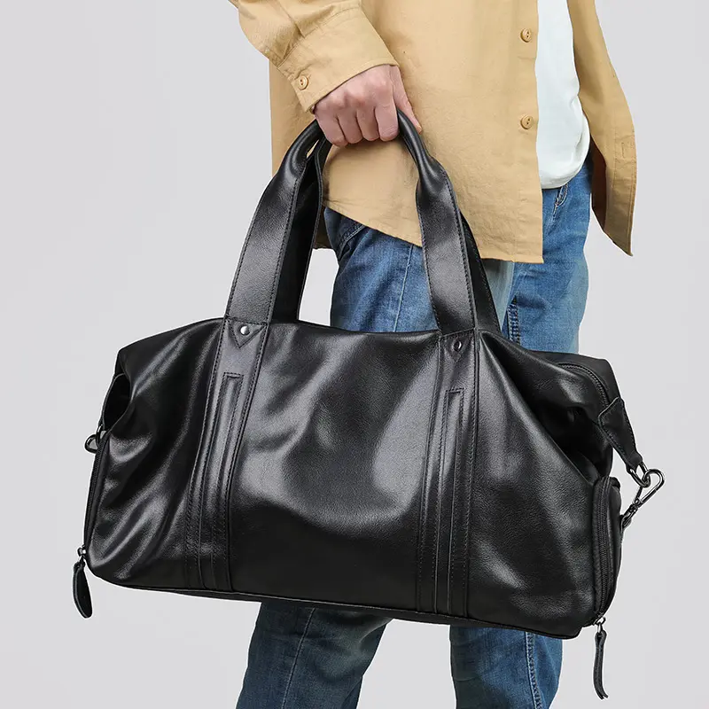 men leather duffle bag carry lifestyle shot