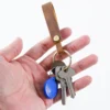 Brown Crazy Horse leather keychain PY-021 shown with keys in hand