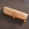 Brown Crazy Horse leather pen pouch T31 closed with wrap strap