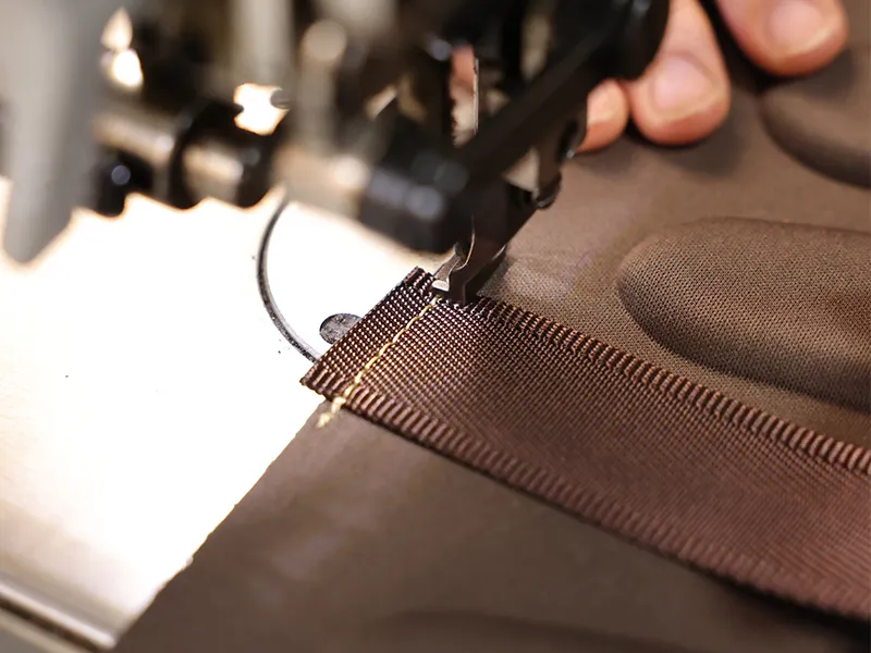Leather bag factory sewing production line showing rows of sewing stations for wholesale leather bag manufacturer capacity audit