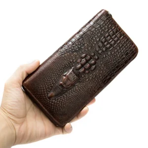 coffee crocodile pattern leather clutch wallet held in hand