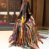 colorful cowhide hobo bag style 588 side view with long fringe