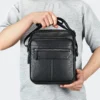 black crossbody bag style 6191 shown at handheld scale