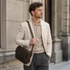 man carrying small Coffee Crazy Horse leather crossbody bag style 6353