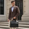 Black leather business briefcase style G5157 carried by hand