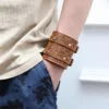 Embossed leather wristlet pouch with zipper compartment