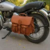Brown leather saddlebags style S1004 mounted beside a motorcycle rear wheel