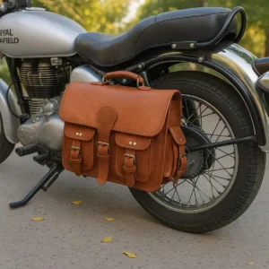 Brown leather saddlebags style S1004 mounted beside a motorcycle rear wheel