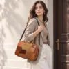 woman carrying cowhide patchwork bag style N7824